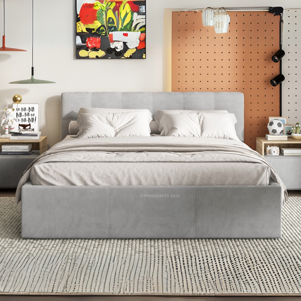 Gray upholstered bed in a modern bedroom with colorful abstract art on the wall.