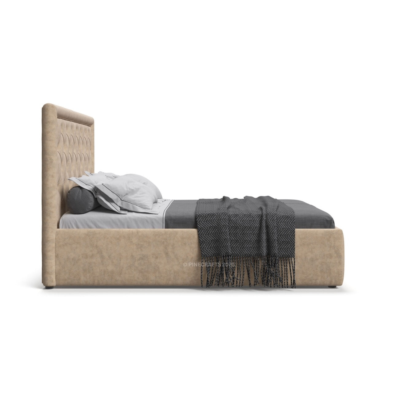 Beige upholstered bed with gray bedding and a blanket on a white background