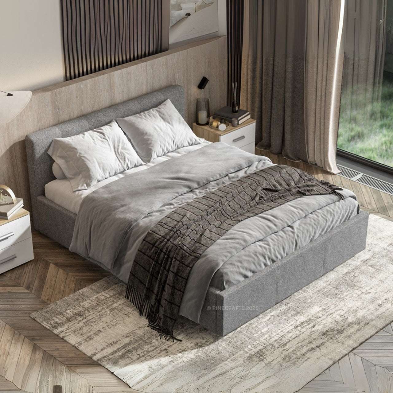 Modern bedroom with a gray upholstered bed, white pillows, and a wooden floor.