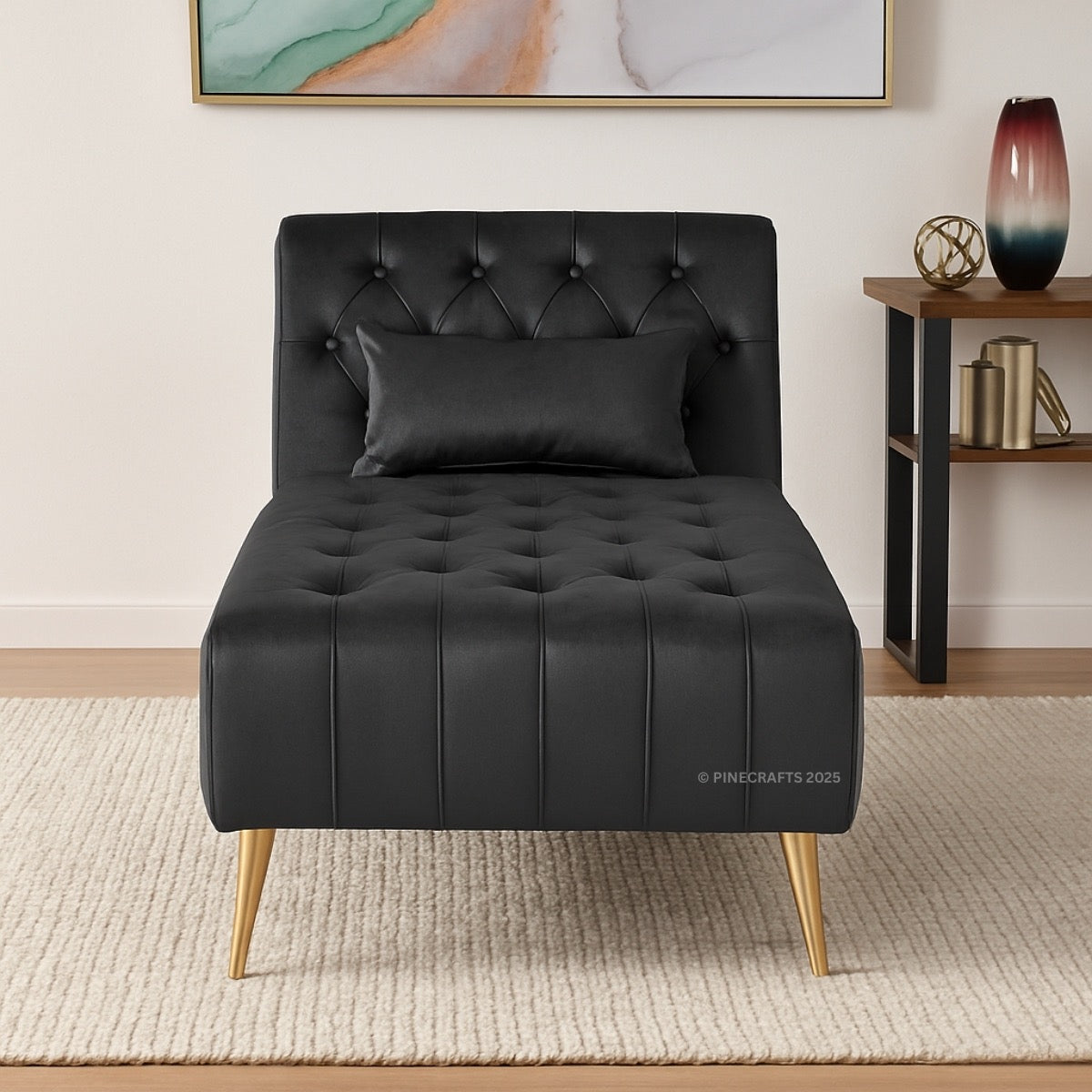 Black tufted chair with gold legs in a room setting