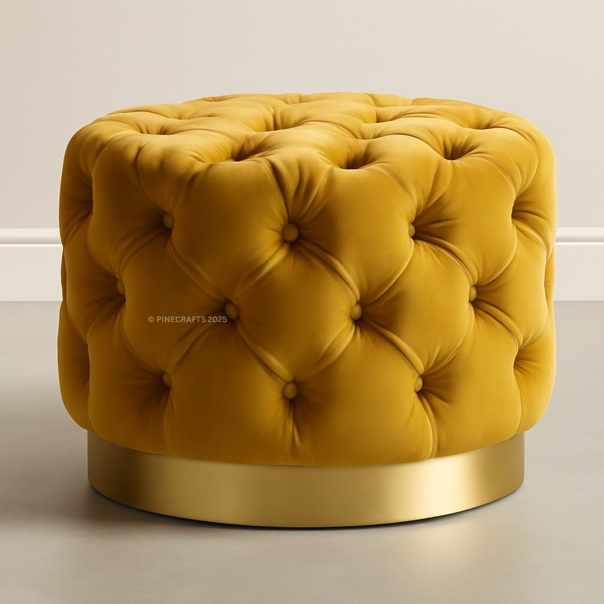 Yellow tufted ottoman with a gold base on a neutral background