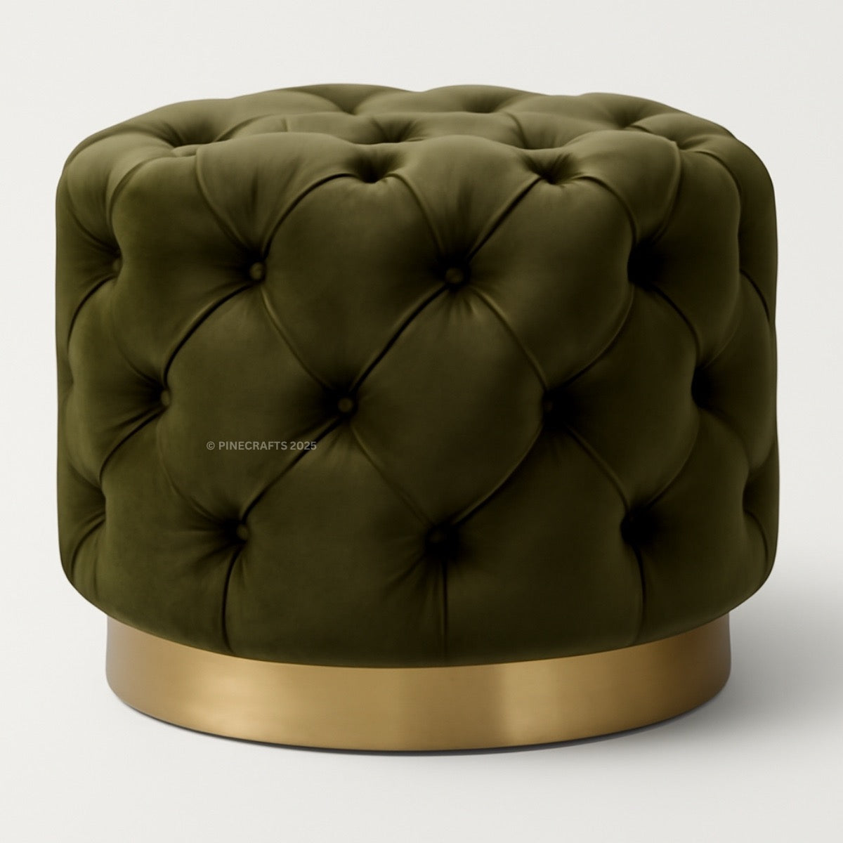 Green tufted ottoman with a gold base on a white background