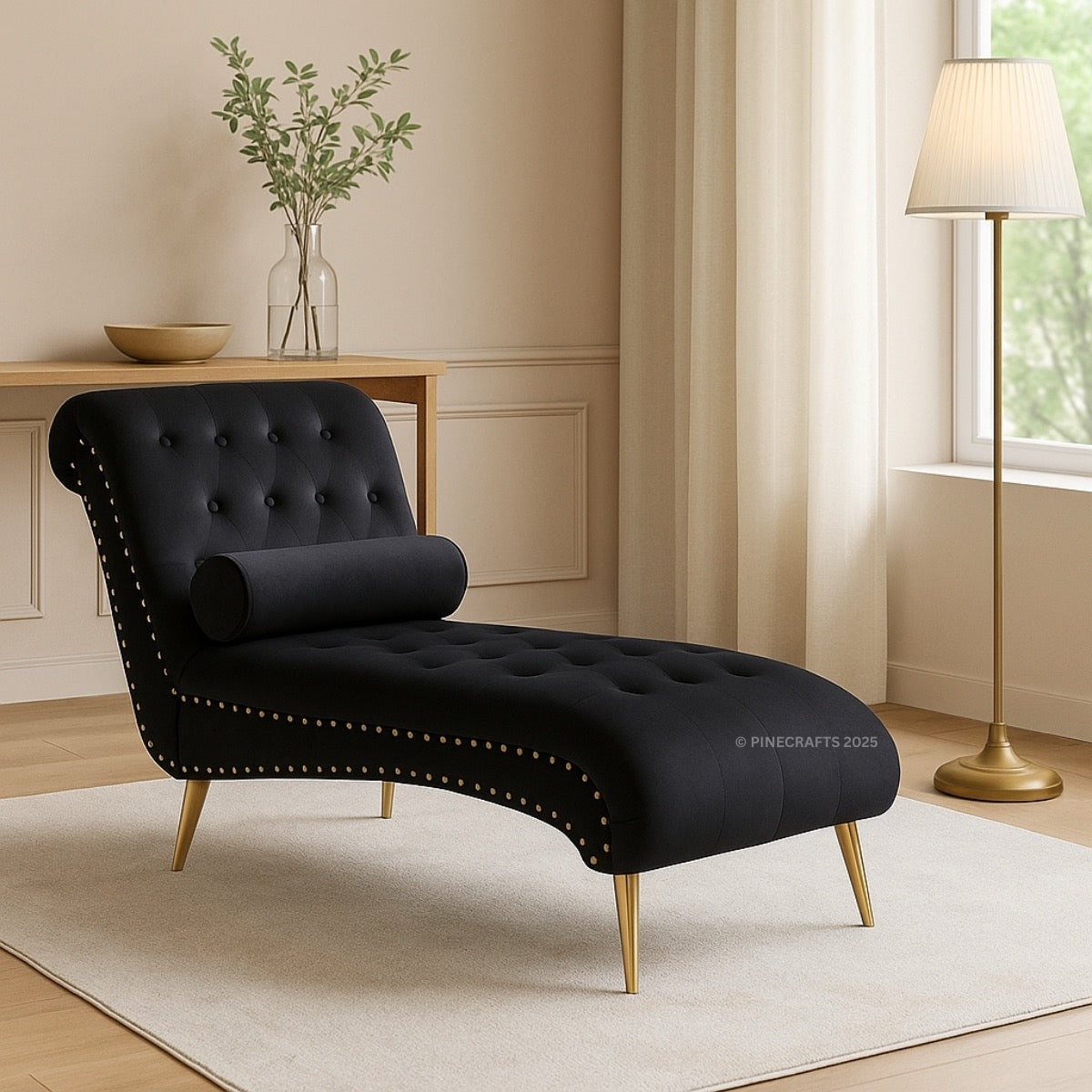 Black chaise lounge in a living room setting with a lamp and table in the background.