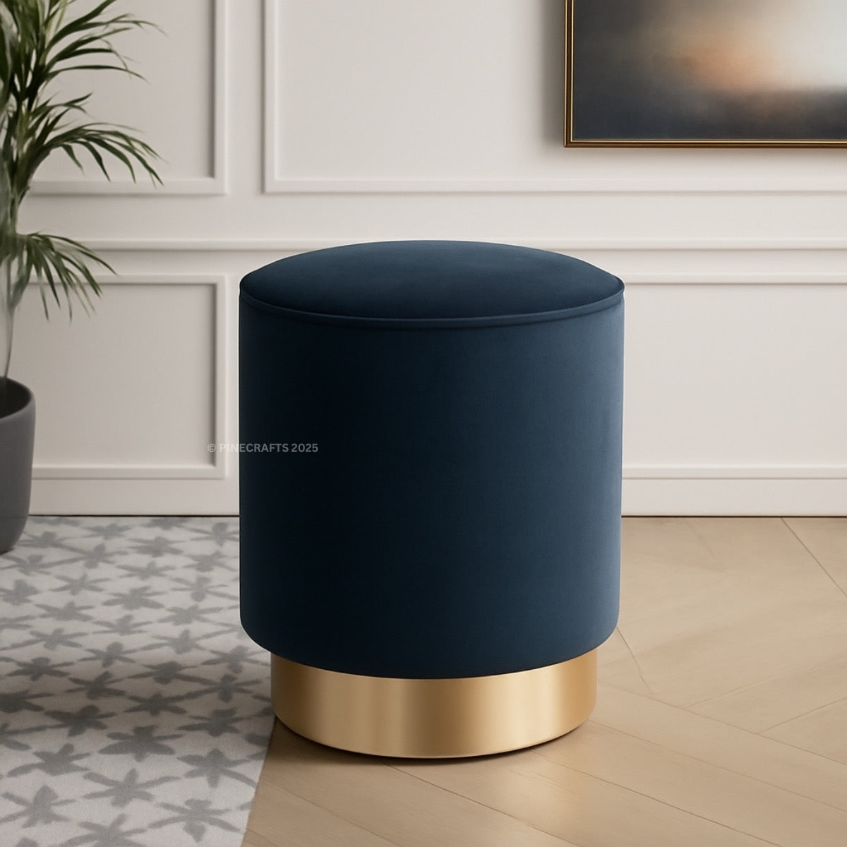 Blue ottoman with gold base in a room setting