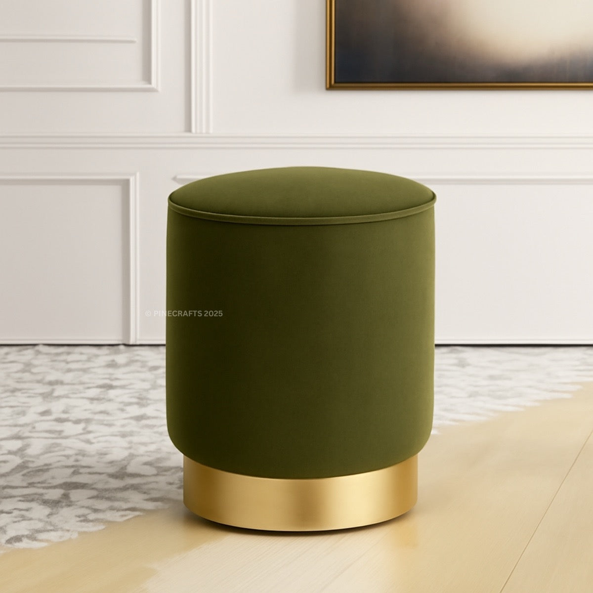 Green ottoman with gold base on a neutral background