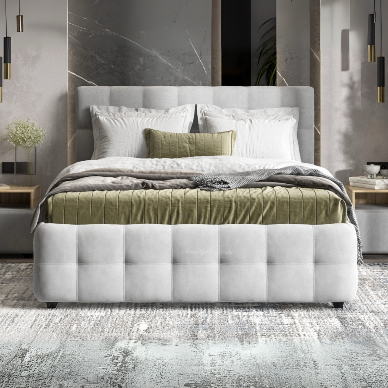 Modern bedroom with a tufted white bed frame, green bedding, and marble wall.