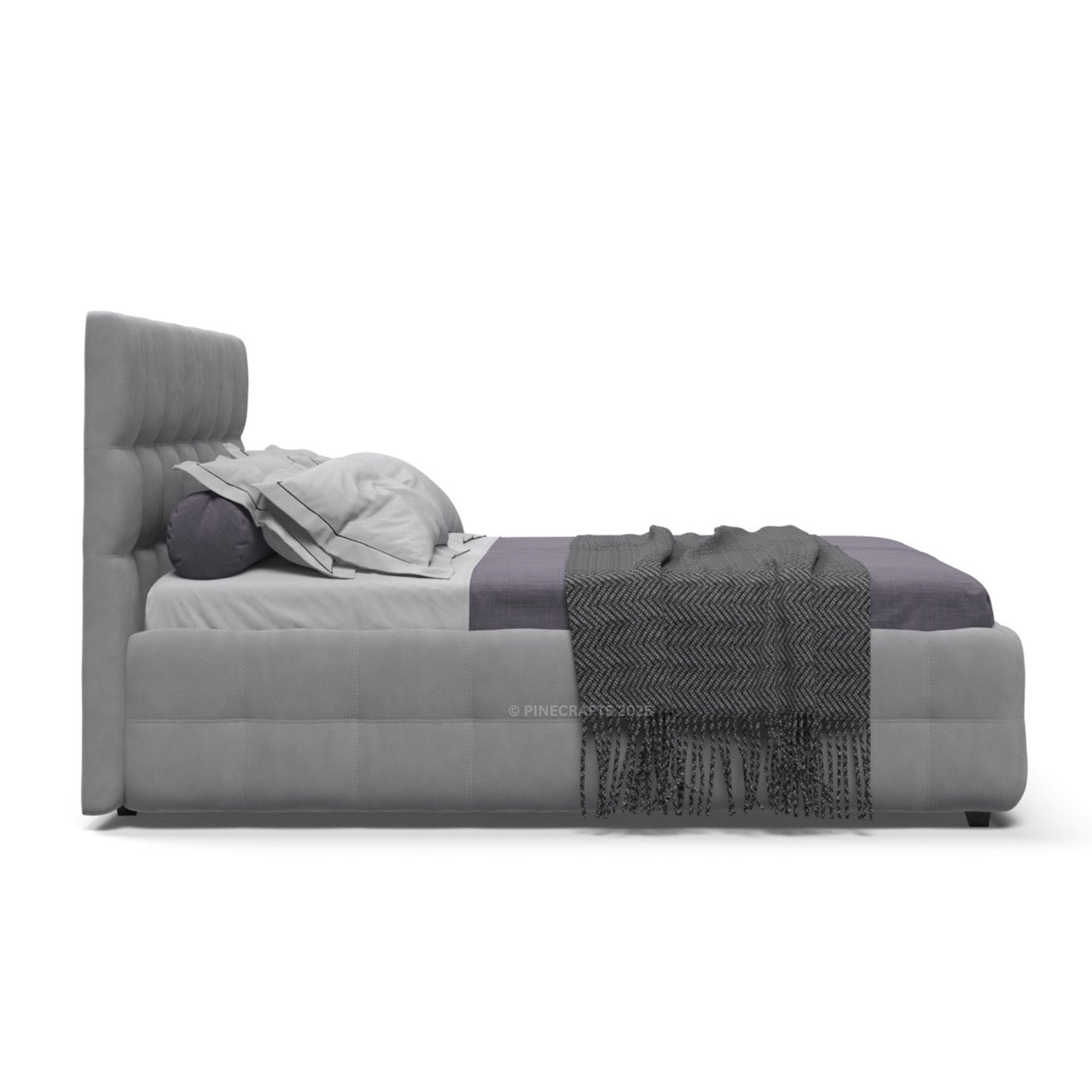 Gray upholstered bed with textured bedding on a white background