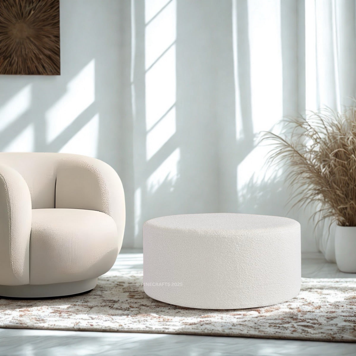 Beige armchair and ottoman in a bright living room with large windows.