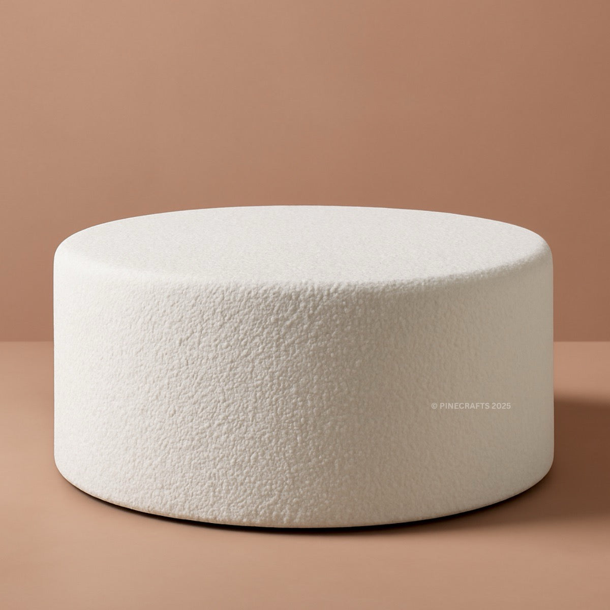 White textured ottoman on a brown background