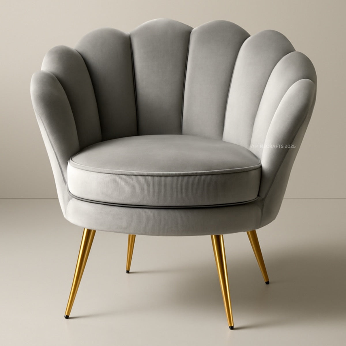 Gray armchair with scalloped backrest and gold legs on a neutral background