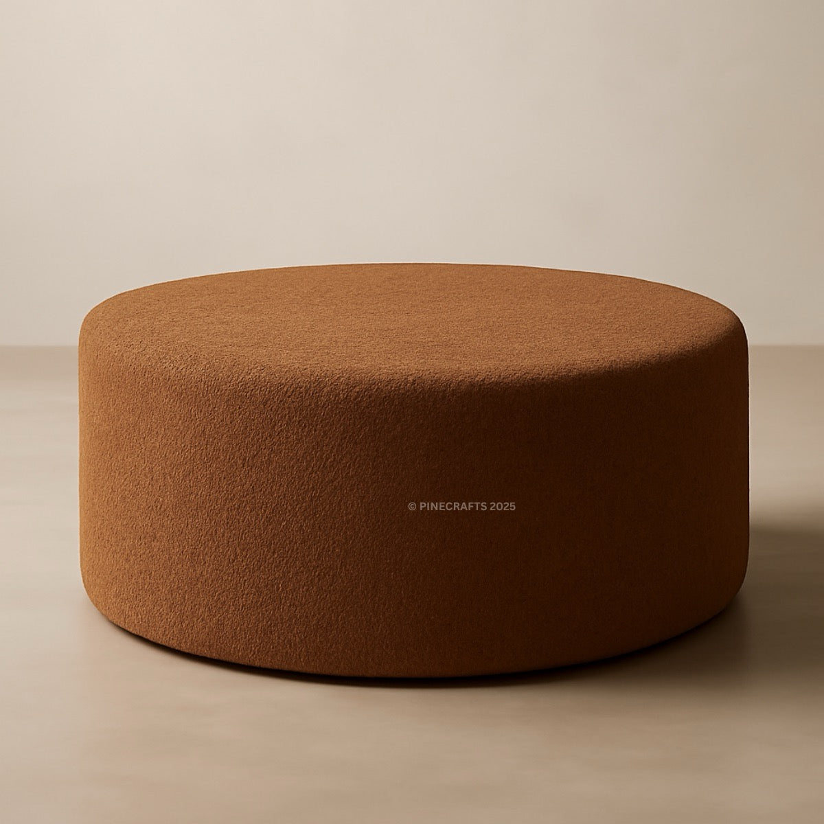 Brown round ottoman on a beige background