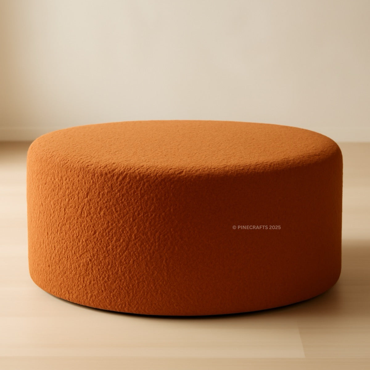 Orange pouf on a beige background