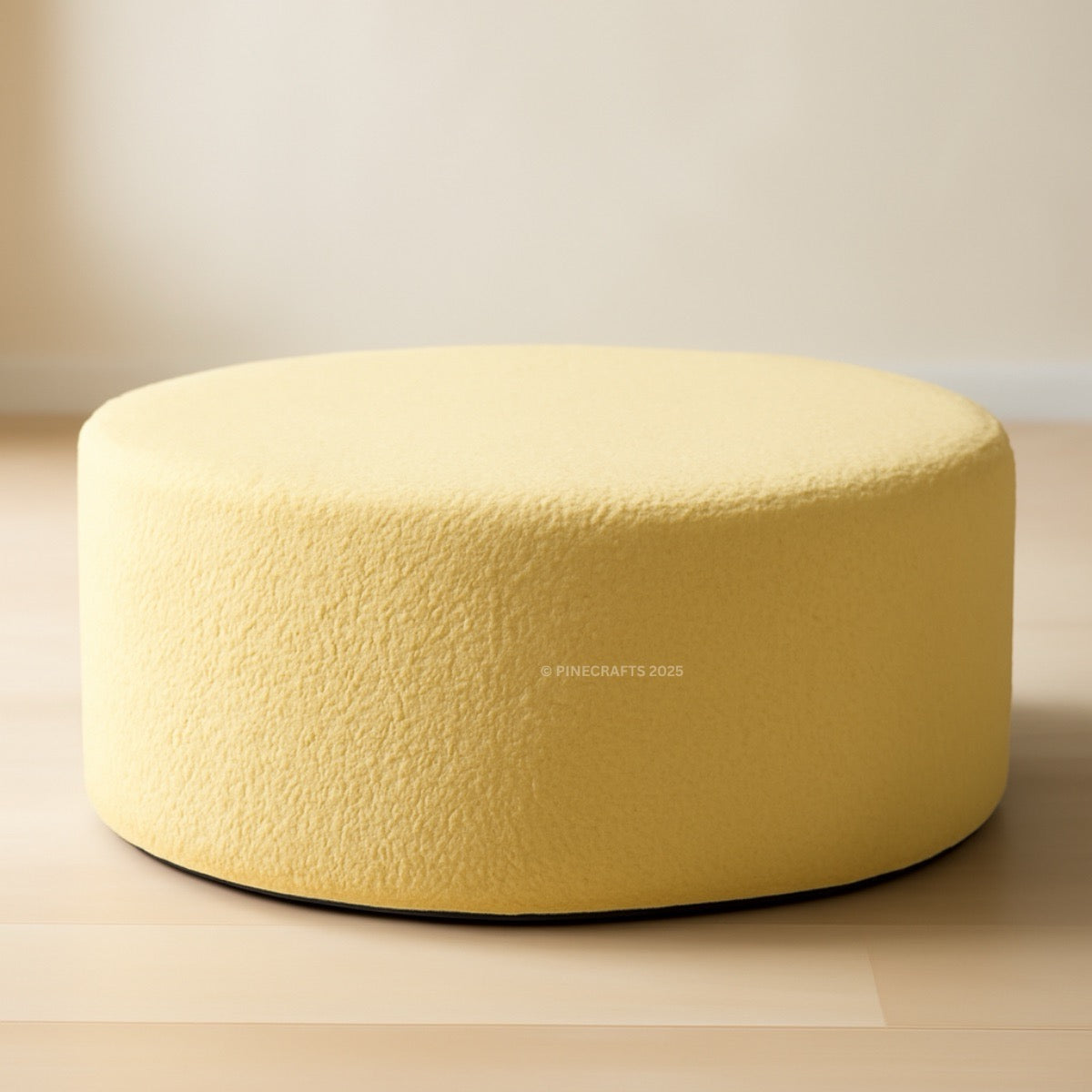 Yellow ottoman on a neutral background