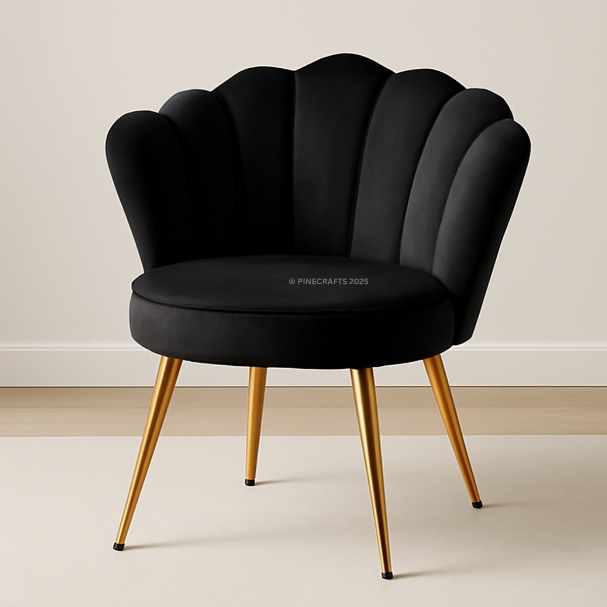 Black shell-shaped chair with gold legs on a beige background
