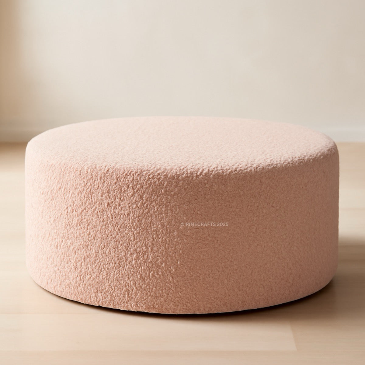 Round pink pouf on a neutral background