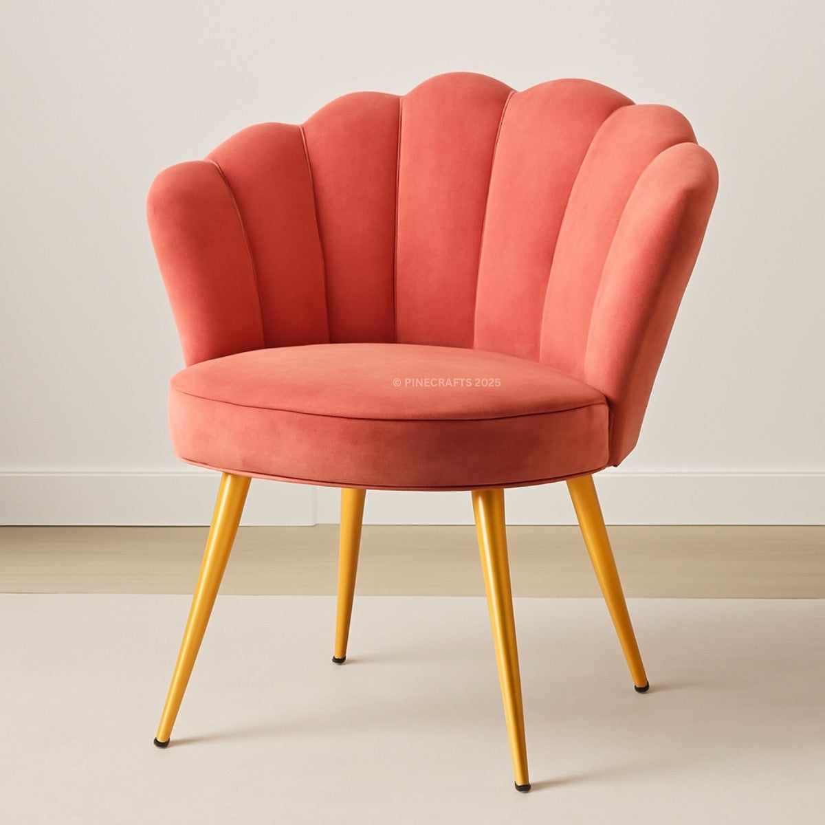 Pink chair with scalloped backrest and gold legs on a plain background