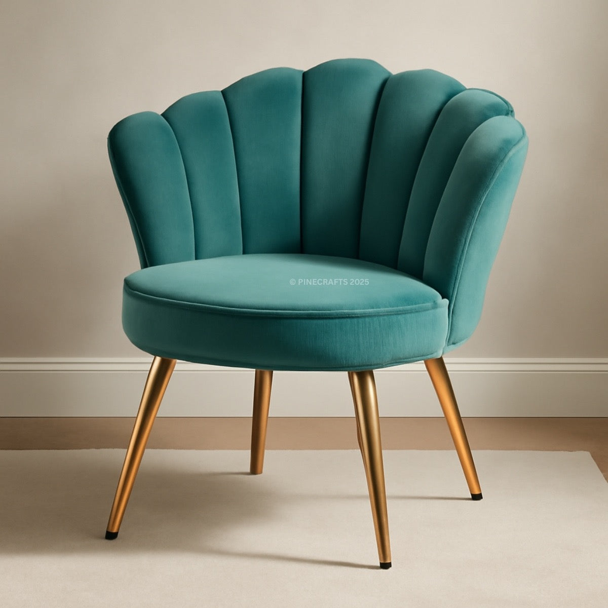 Teal velvet armchair with gold legs on a neutral background