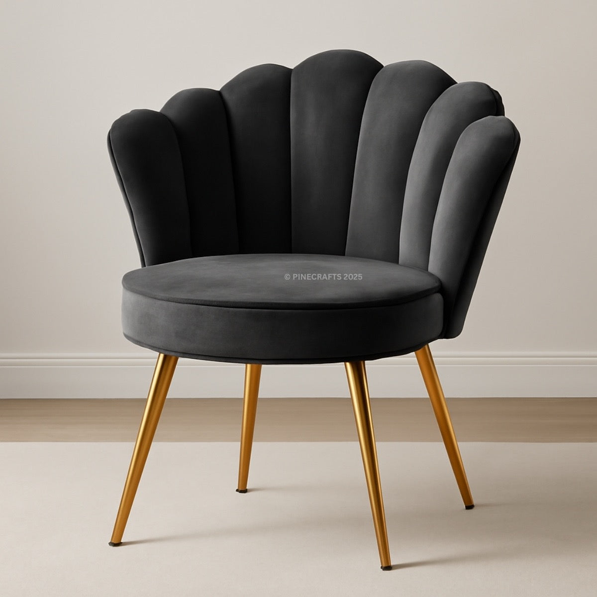 Gray chair with scalloped backrest and gold legs on a neutral background