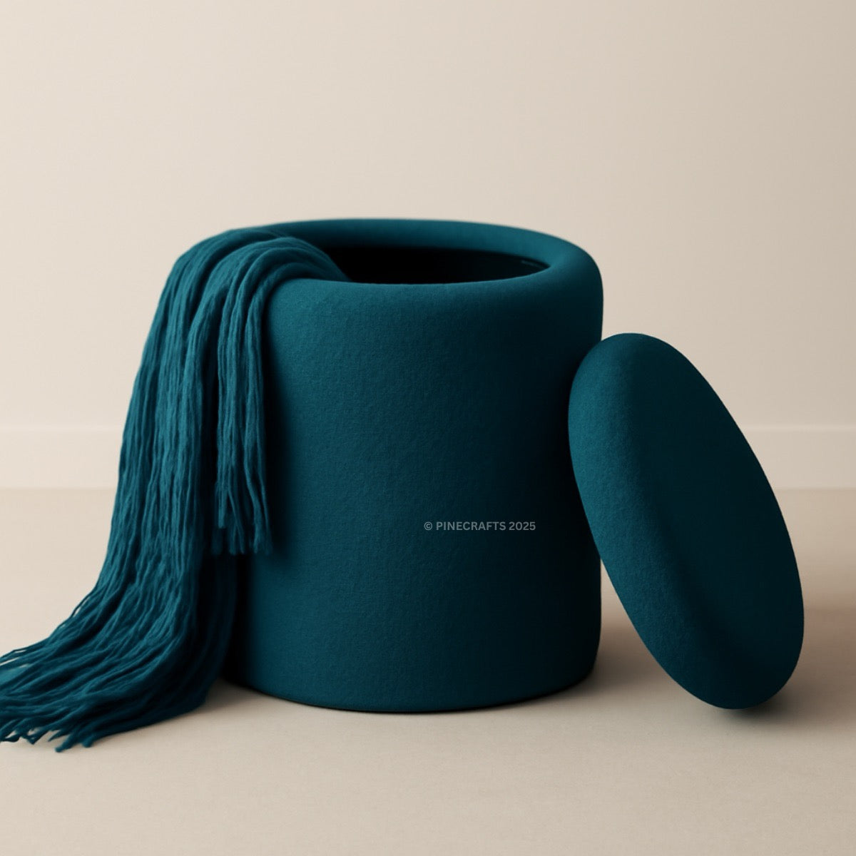 Teal storage basket with a matching lid and teal scarf on a beige background