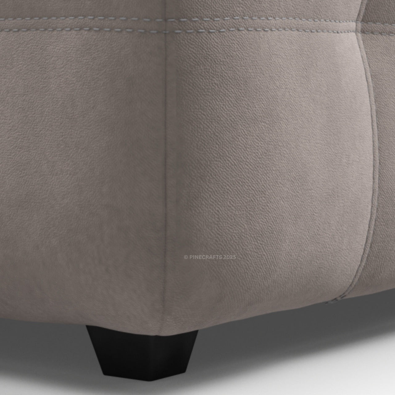 Close-up of a gray upholstered chair with visible stitching details.