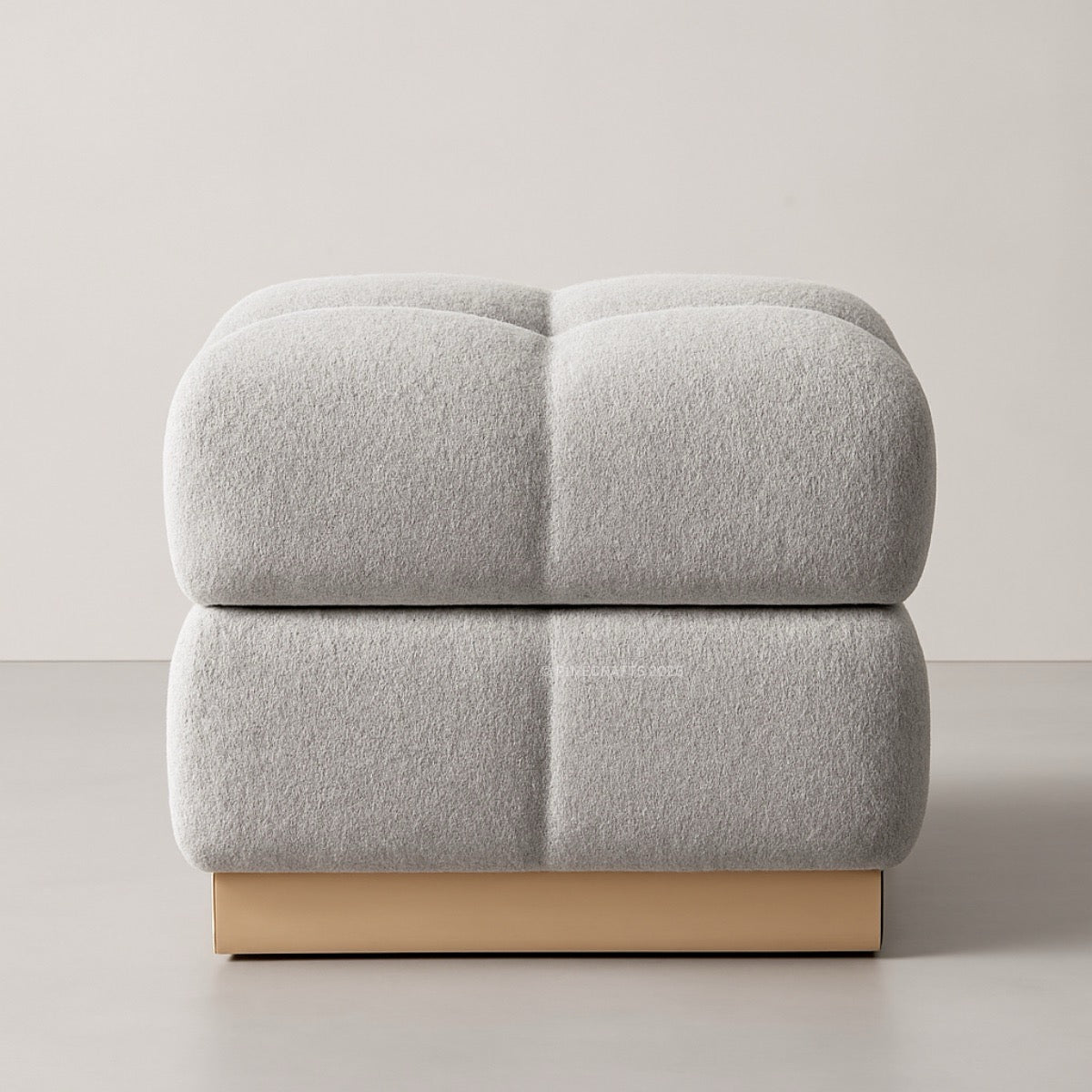 Gray upholstered chair with a wooden base on a plain background