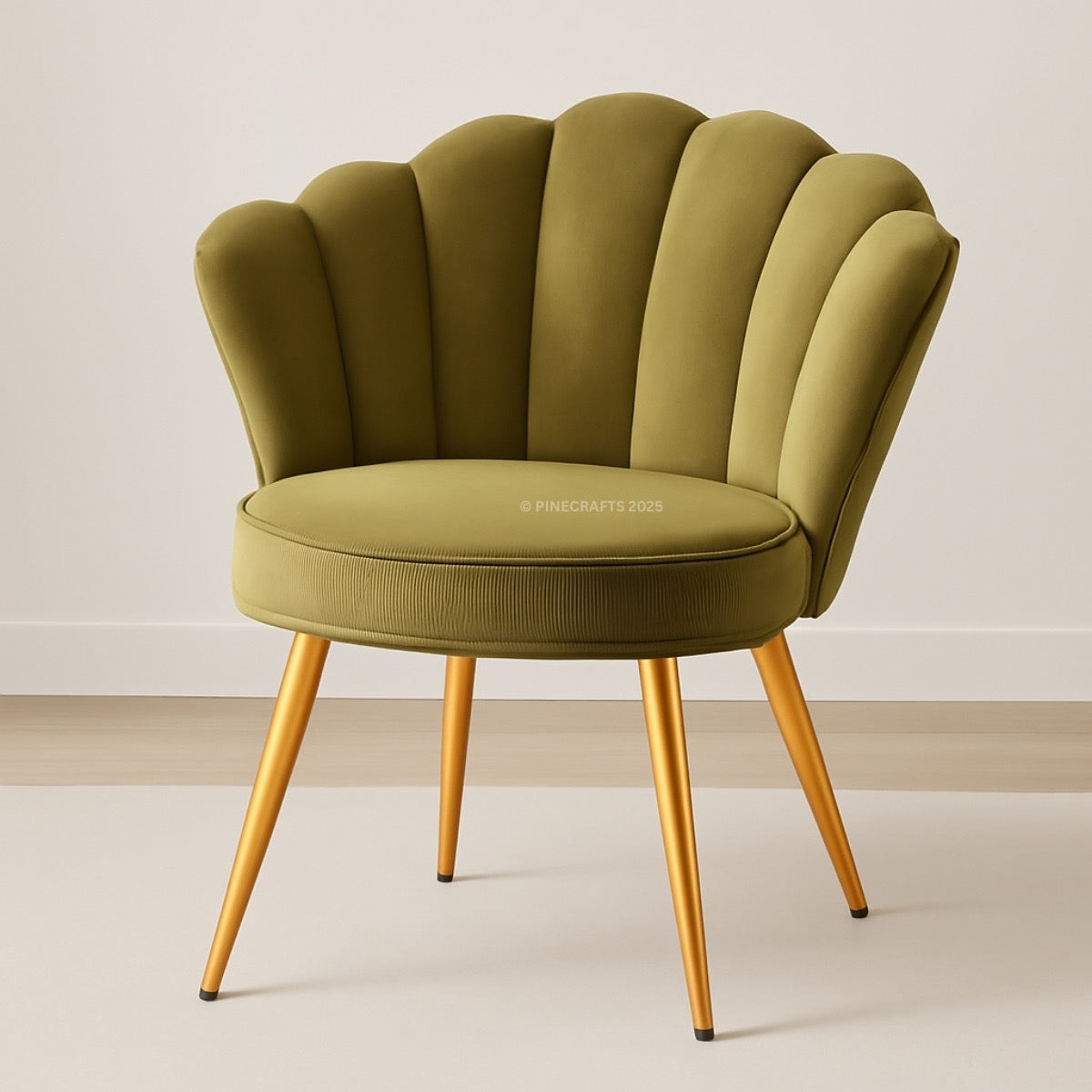 Green shell-back chair with gold legs on a plain background