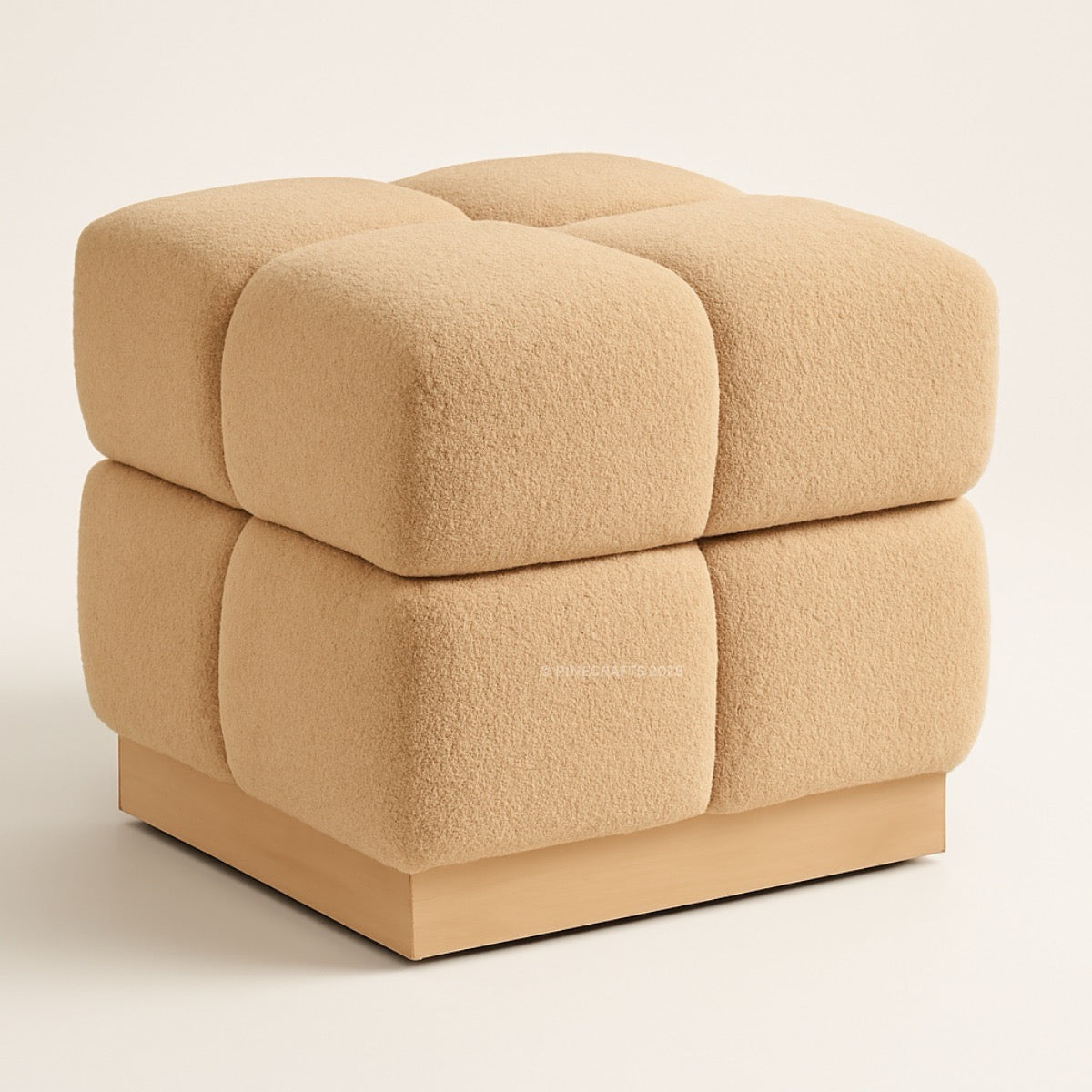 Beige cube-shaped ottoman on a light beige background