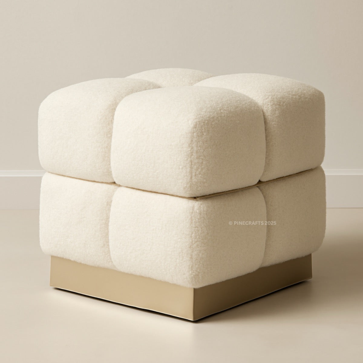 Beige cube-shaped ottoman on a neutral background