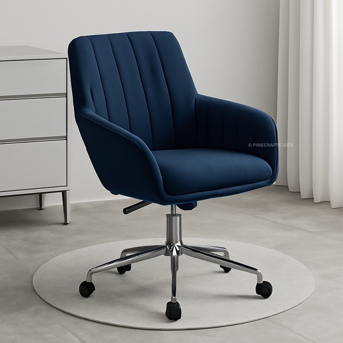 Blue office chair with a white dresser and curtains in the background