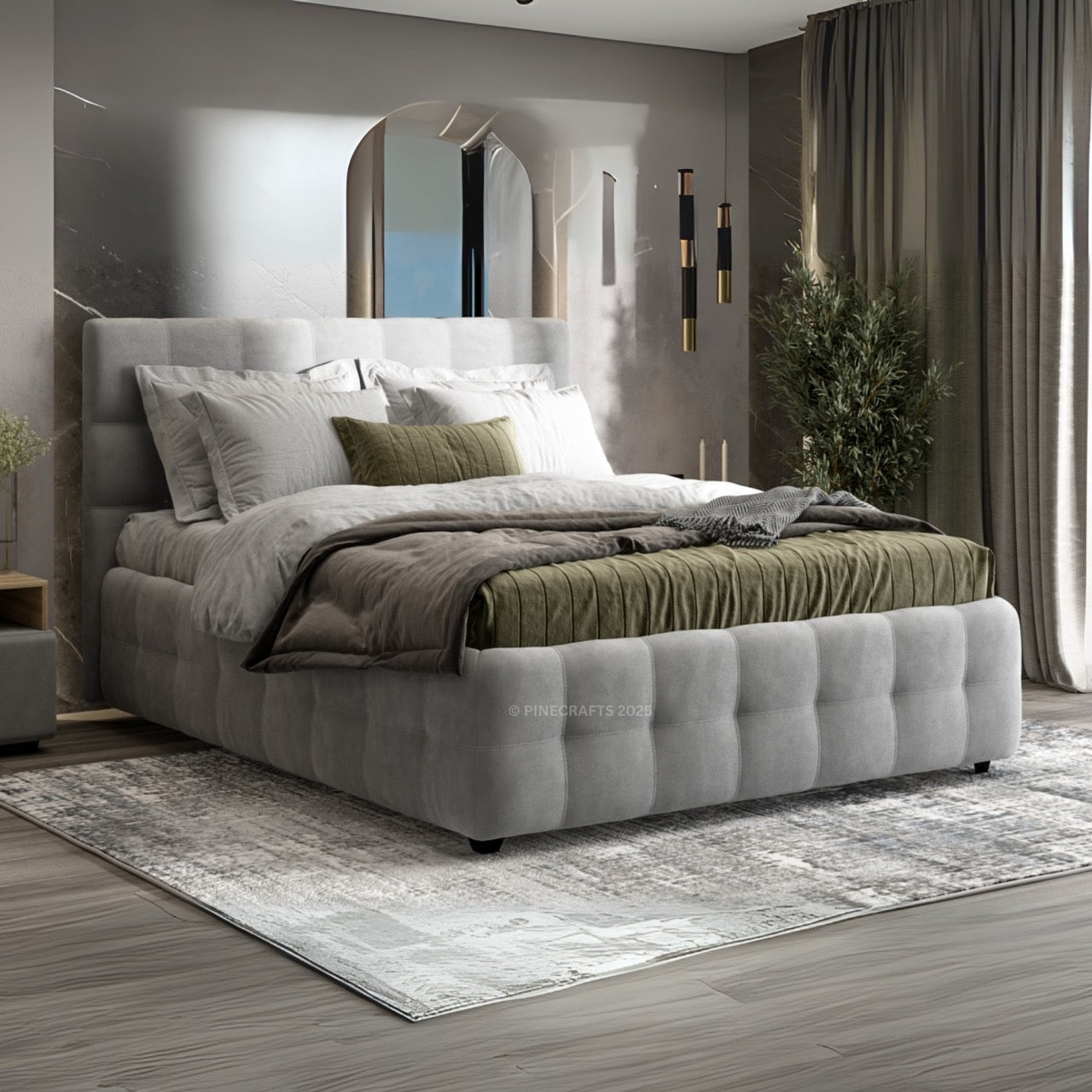 Modern bedroom with a gray upholstered bed and decorative pillows.