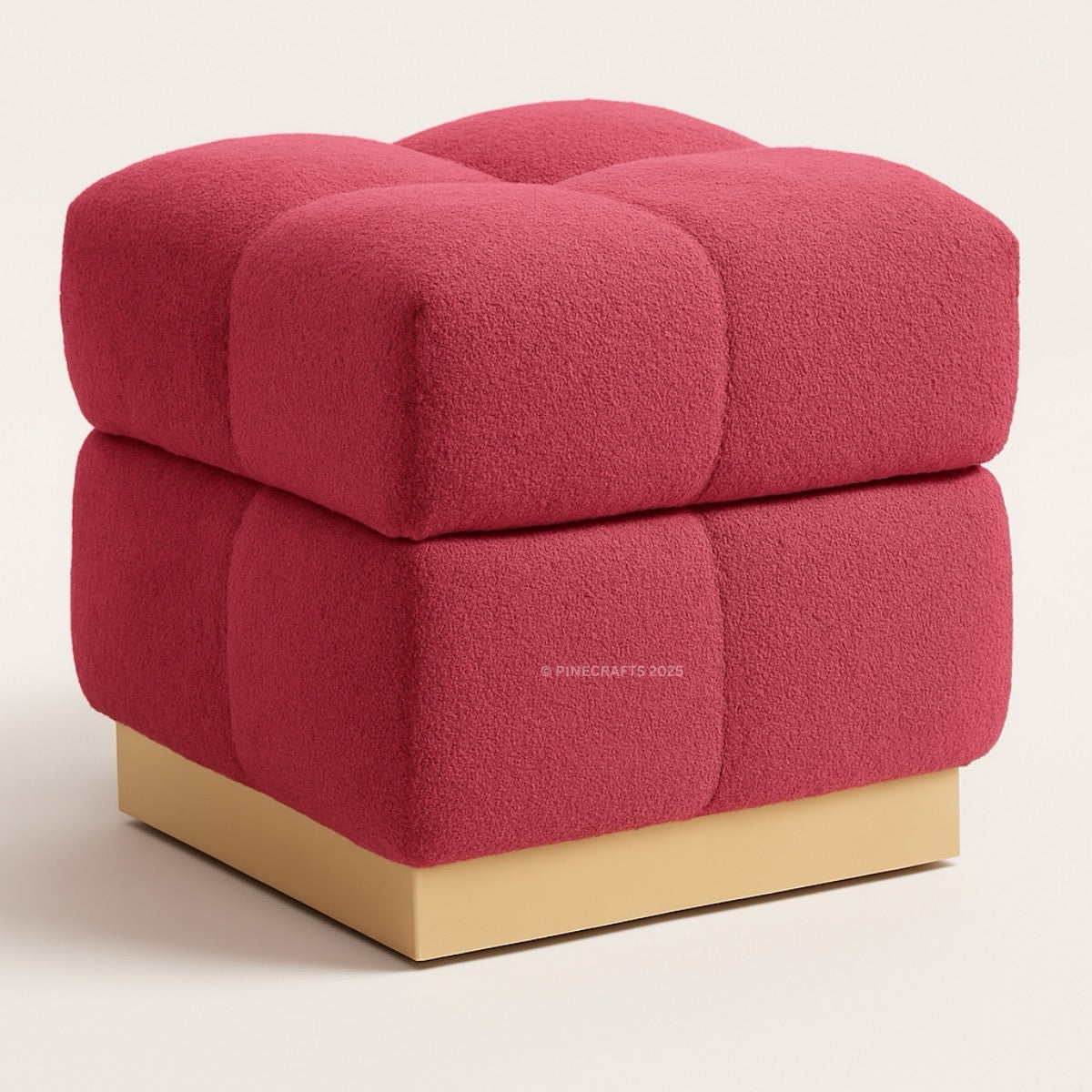 Red cube-shaped ottoman with a beige base on a light background