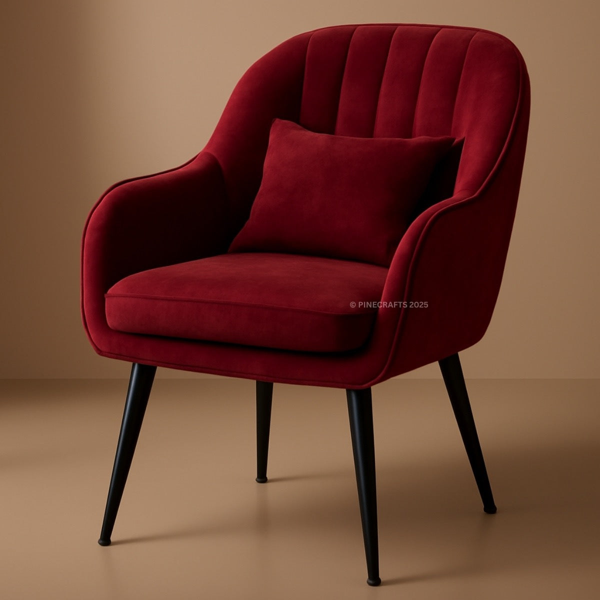 Red velvet armchair with a pillow on a brown background