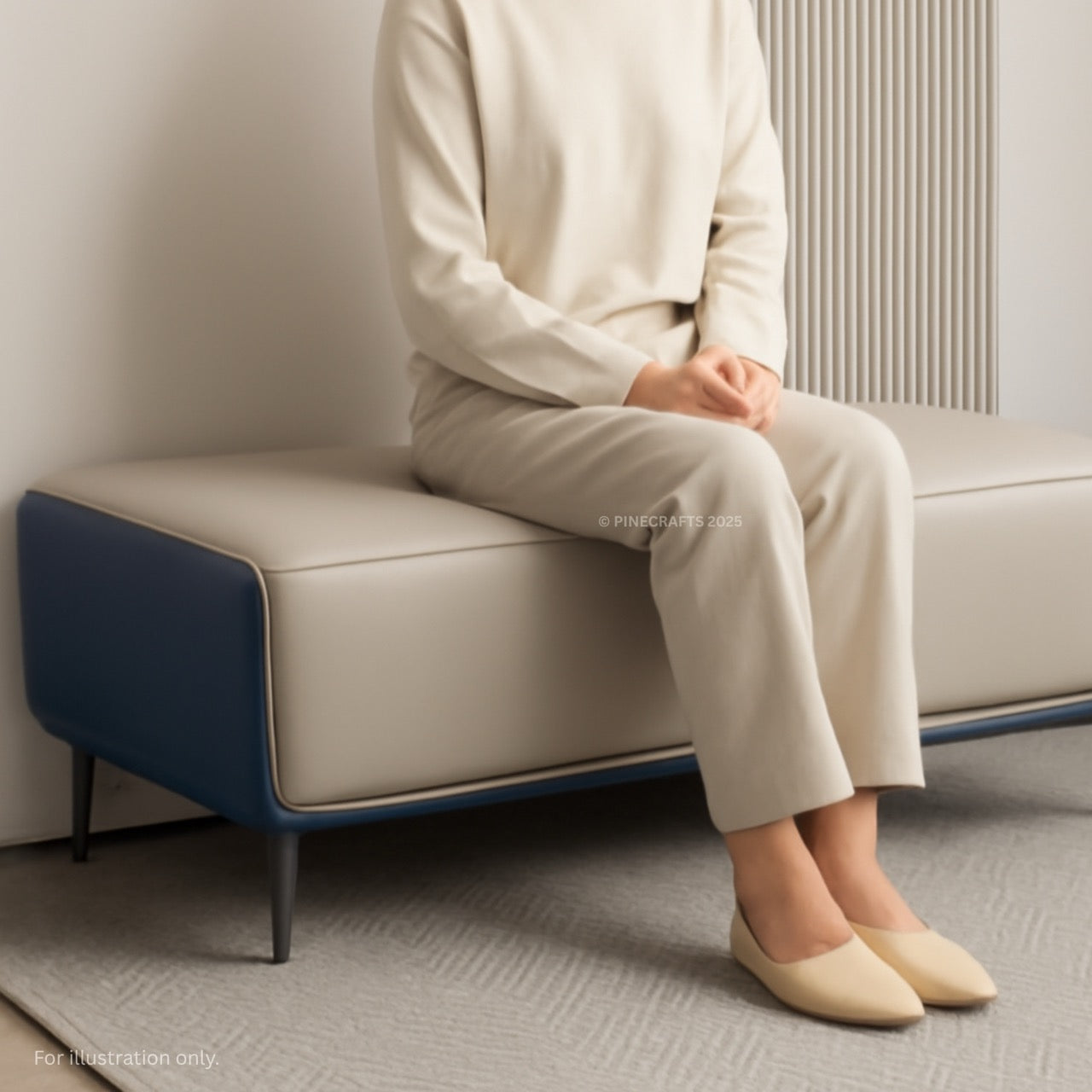 Person sitting on a modern sofa with a neutral color palette