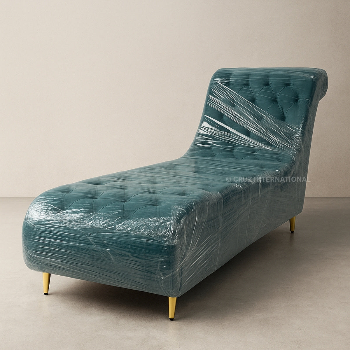 Teal chaise lounge wrapped in plastic on a beige background