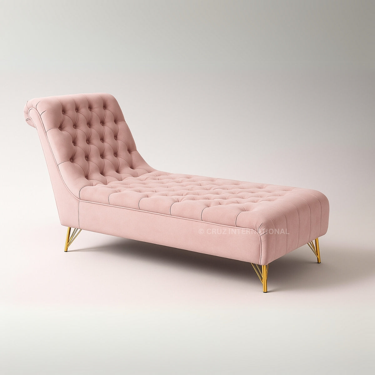 Pink tufted chaise lounge with gold legs on a light gray background