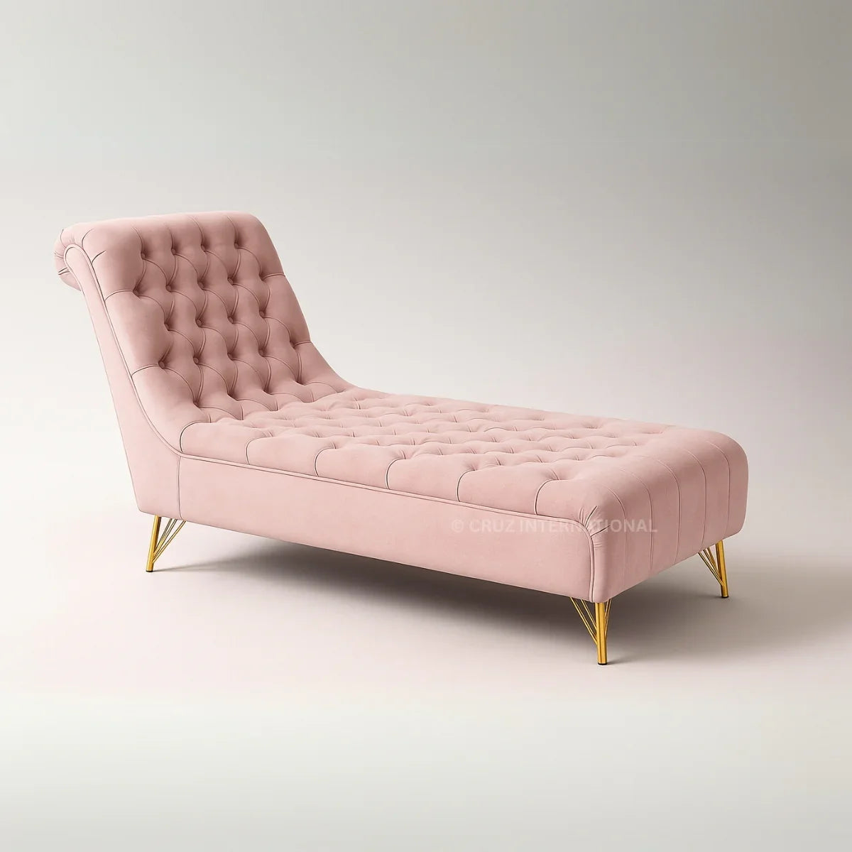 Pink tufted chaise lounge with gold legs on a light gray background