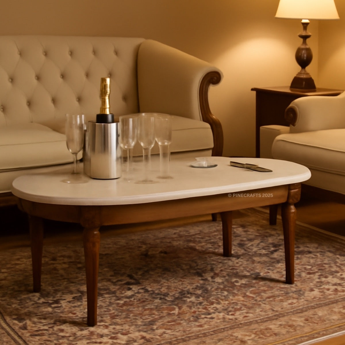 Living room with a coffee table, champagne bottle, and glasses.