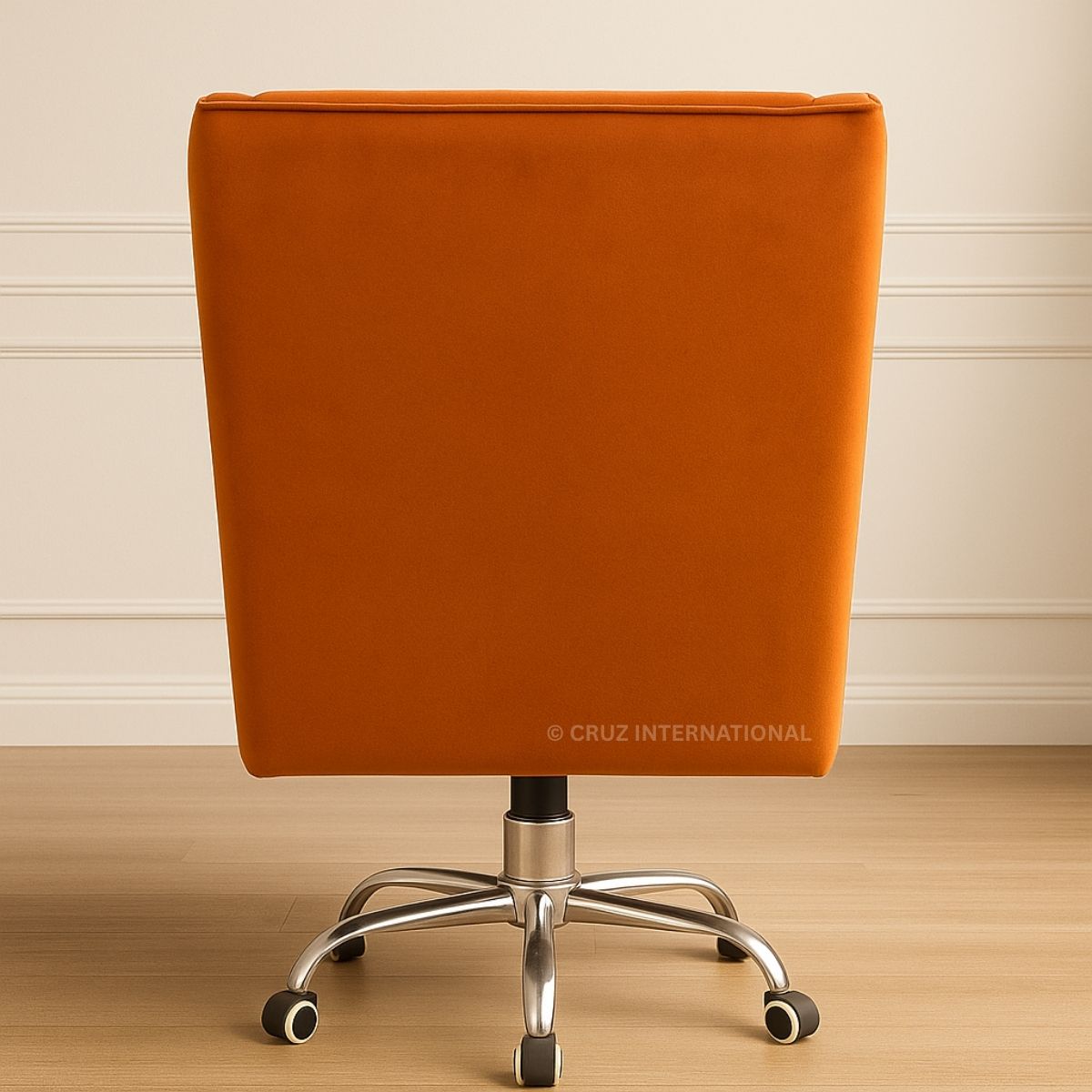 Orange office chair with metal base on a wooden floor against a beige wall.