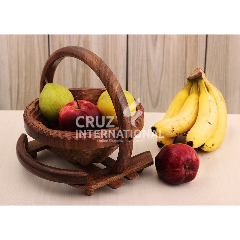 Wooden fruit basket with apples, pears, bananas on table at CRUZ INTERNATIONAL furniture store