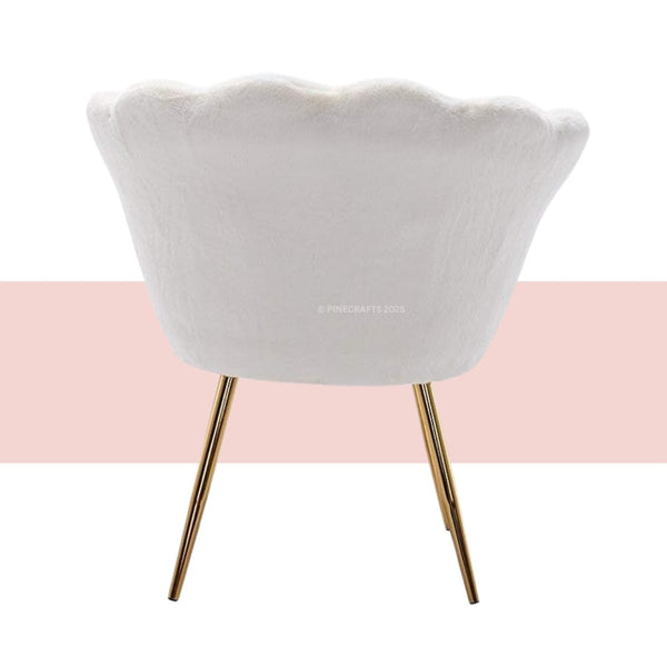 White chair with gold legs on a white and pink background