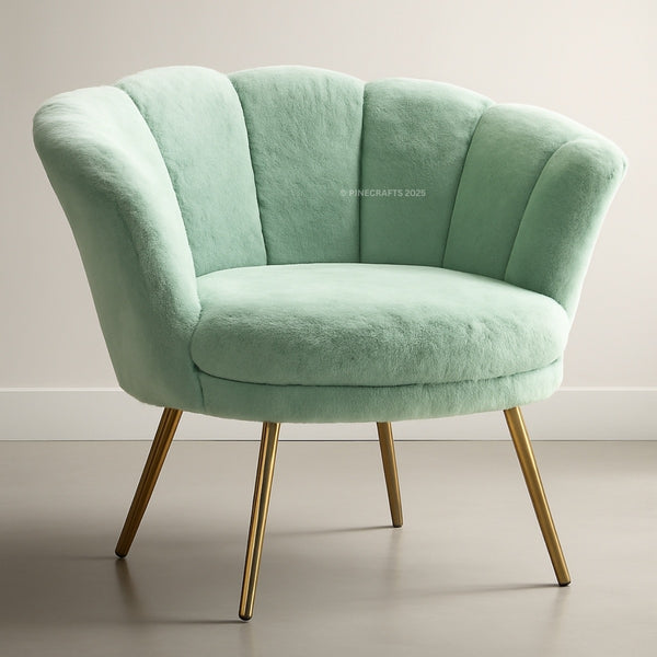 Green armchair with gold legs on a neutral background