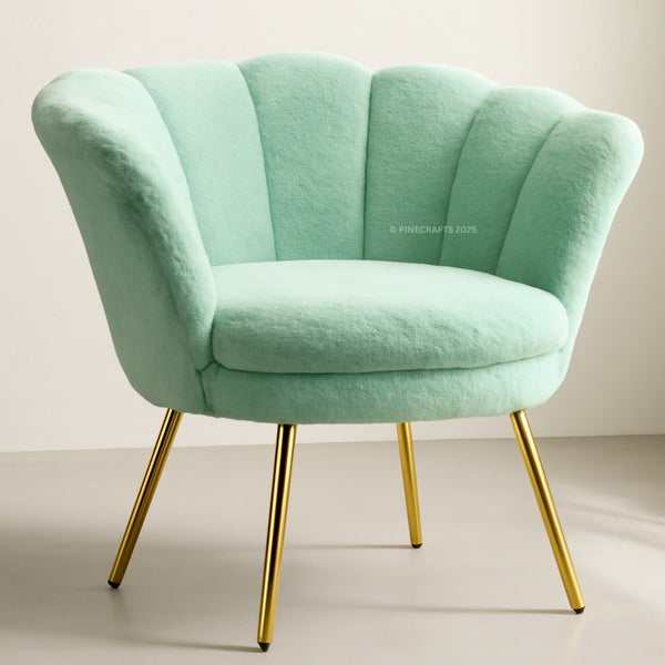 Mint green armchair with gold legs on a beige background