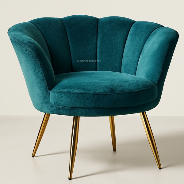 Teal velvet armchair with gold legs on a light background