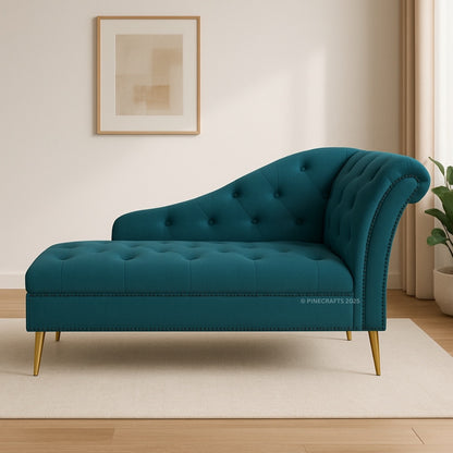 Teal chaise lounge in a room with a framed picture on the wall.