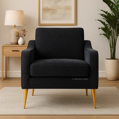 Black armchair in a room with a side table, lamp, and plant