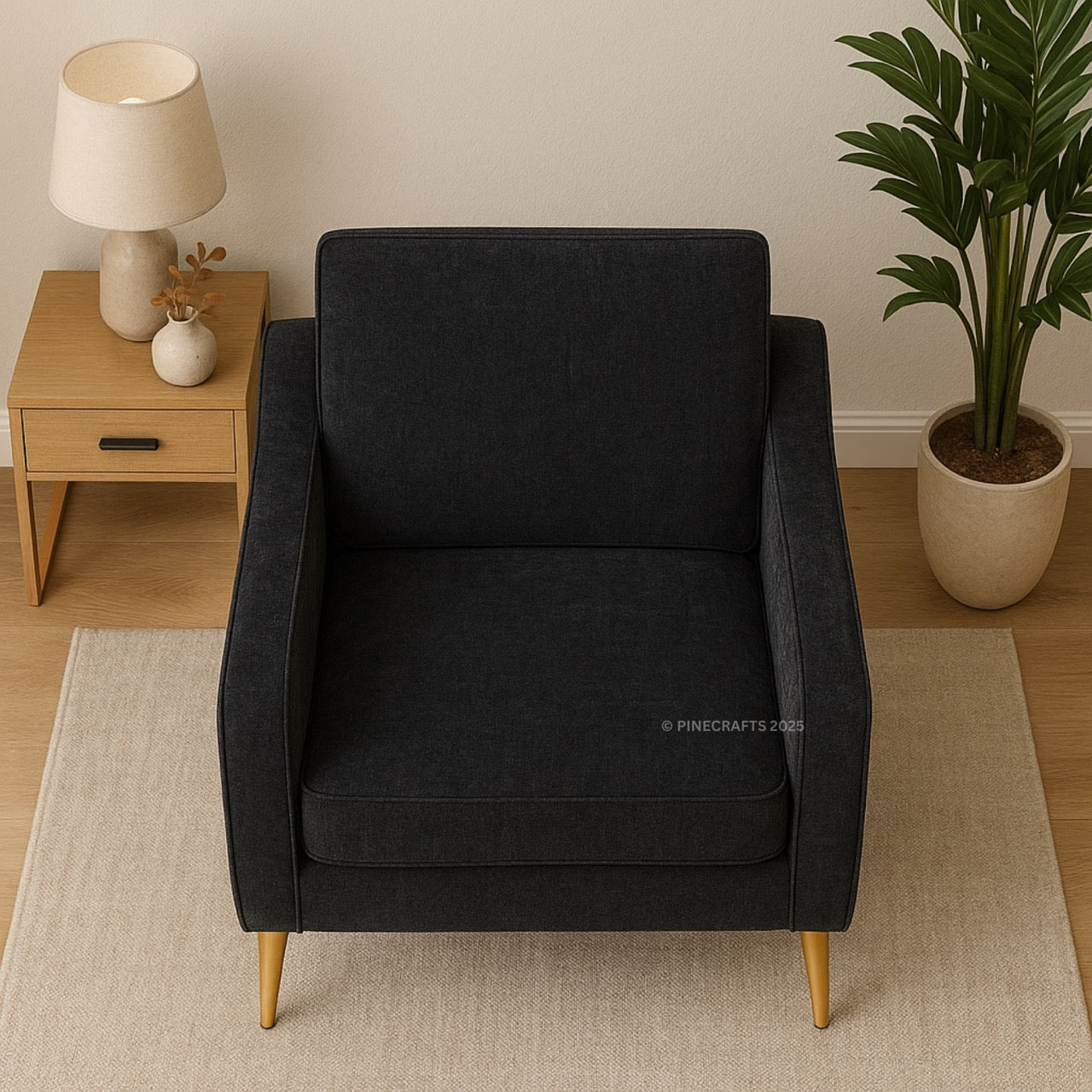 Black armchair in a room with a side table, lamp, and plant.