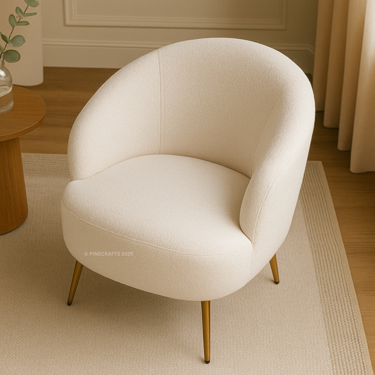 White armchair with gold legs in a room setting