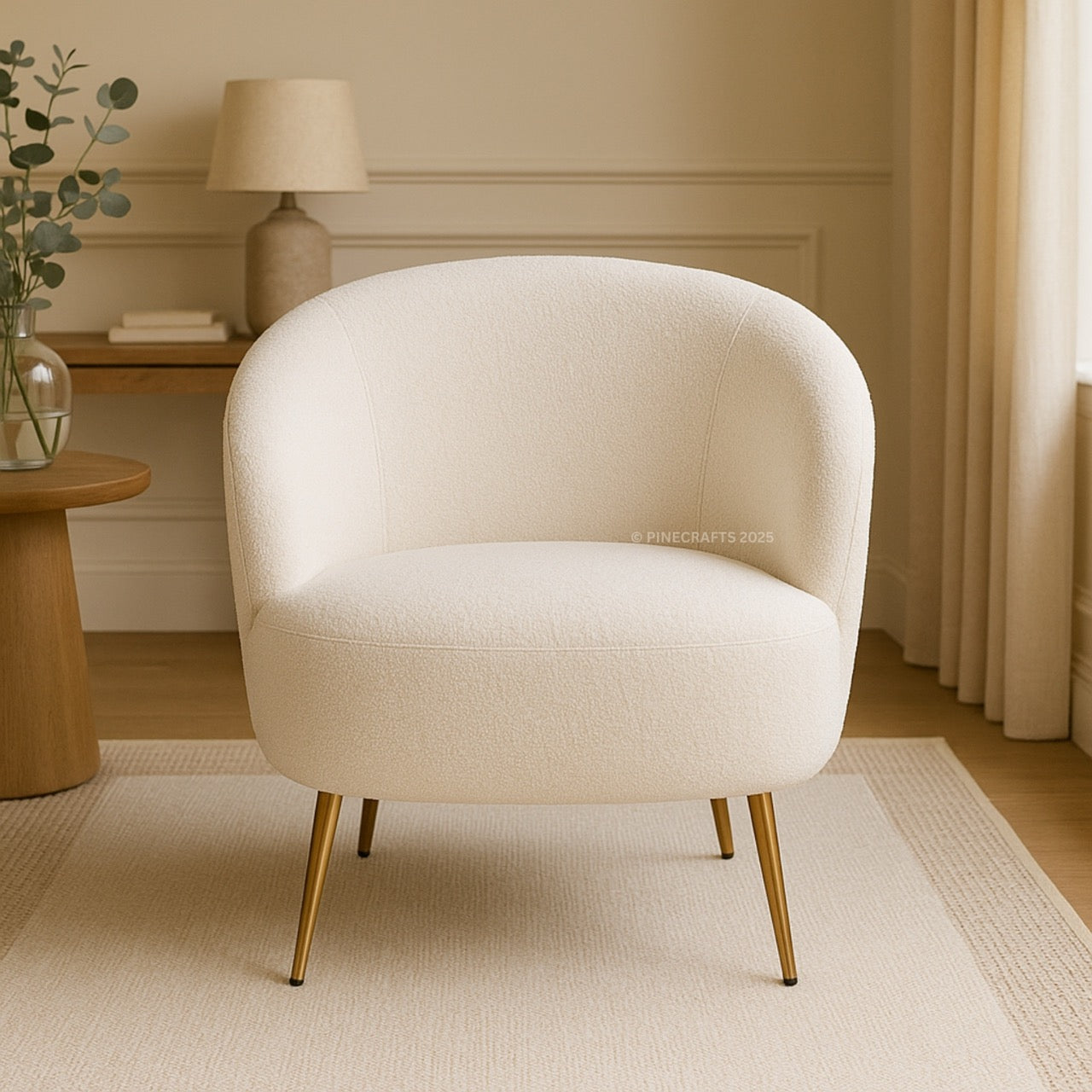 Beige armchair with gold legs in a room with a lamp and plant