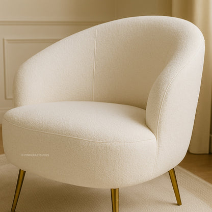 Beige armchair with gold legs in a room setting