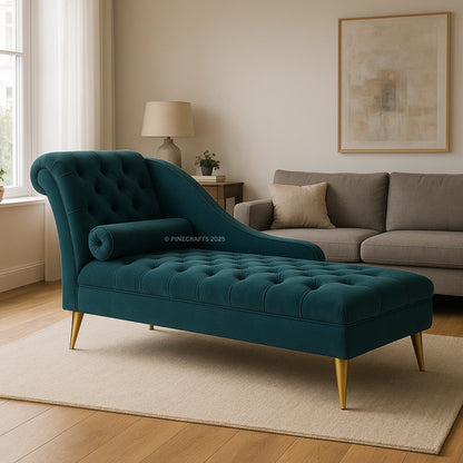 Teal chaise lounge in a living room setting with a gray sofa and lamp.